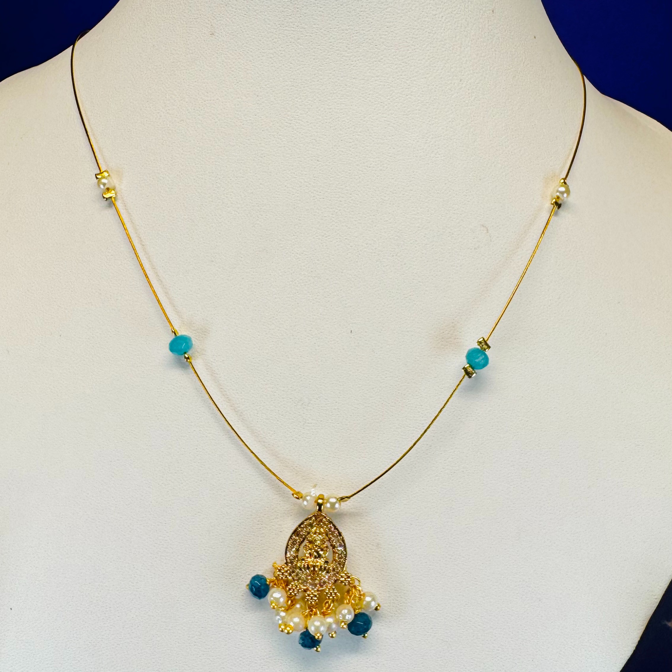 Elegant High Gold Necklace with Temple Pendant